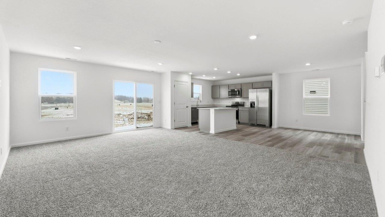 open layout living, dining, and kitchen