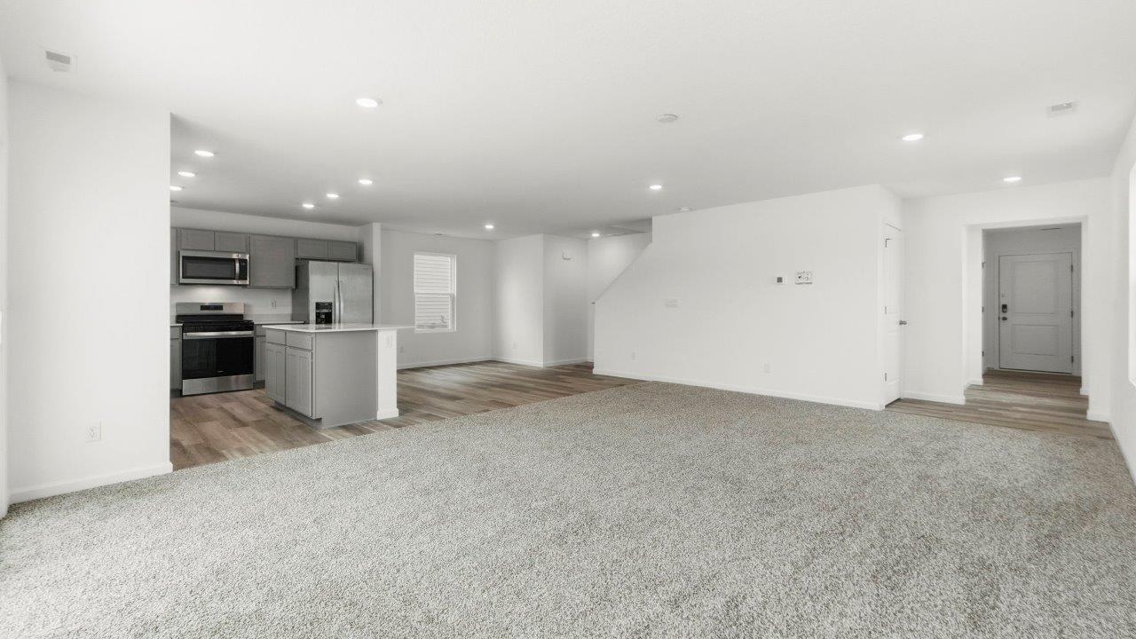 open layout living, dining, and kitchen