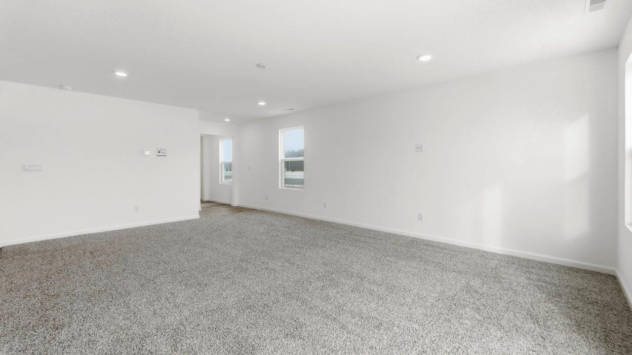living room open layout with carpet flooring