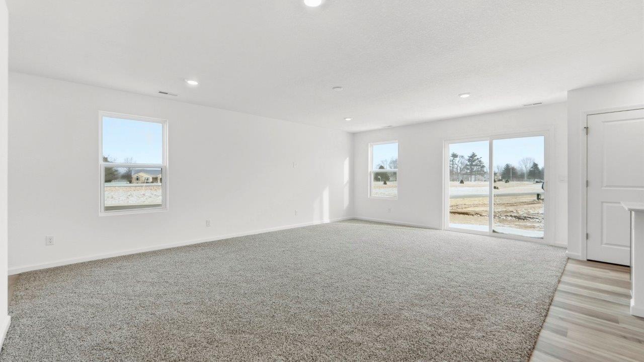 living room open layout with carpet flooring