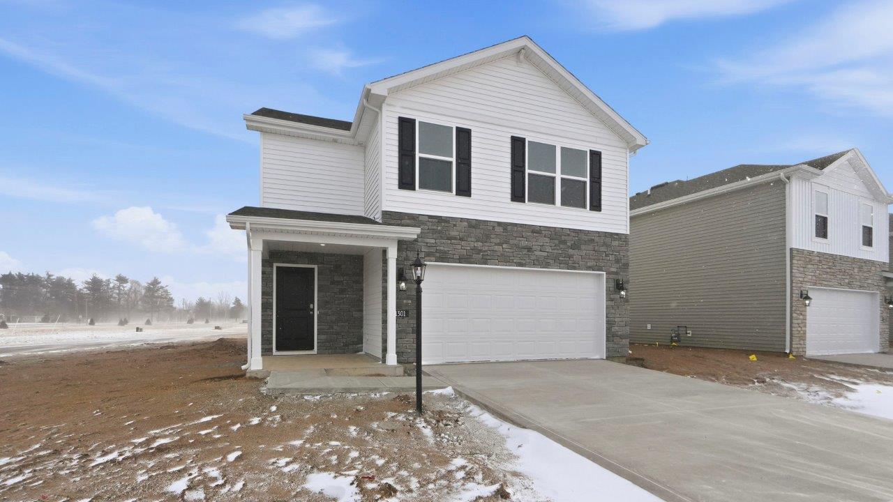 Greenbrier Elder exterior with 2 car garage and covered patio