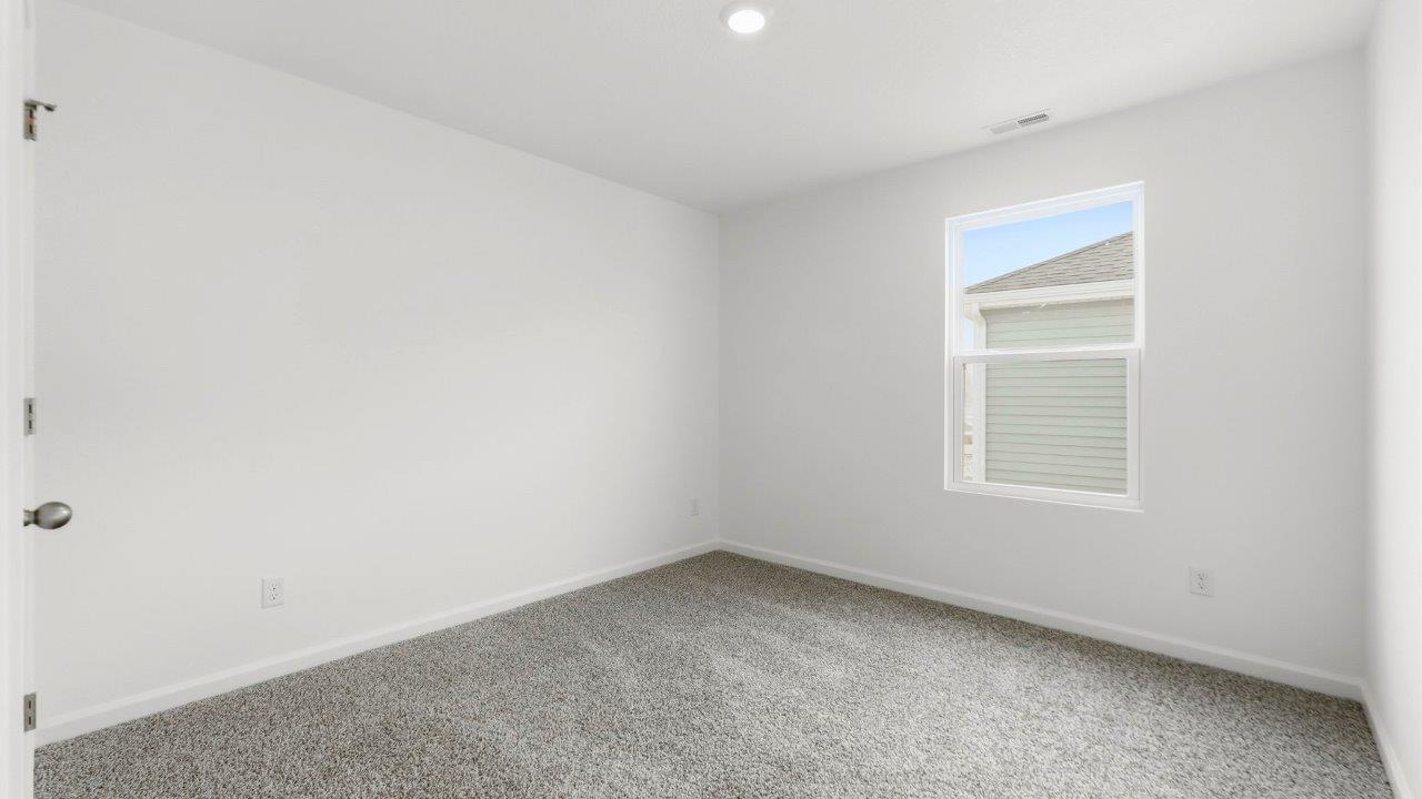 bedroom 3 with carpet and closet