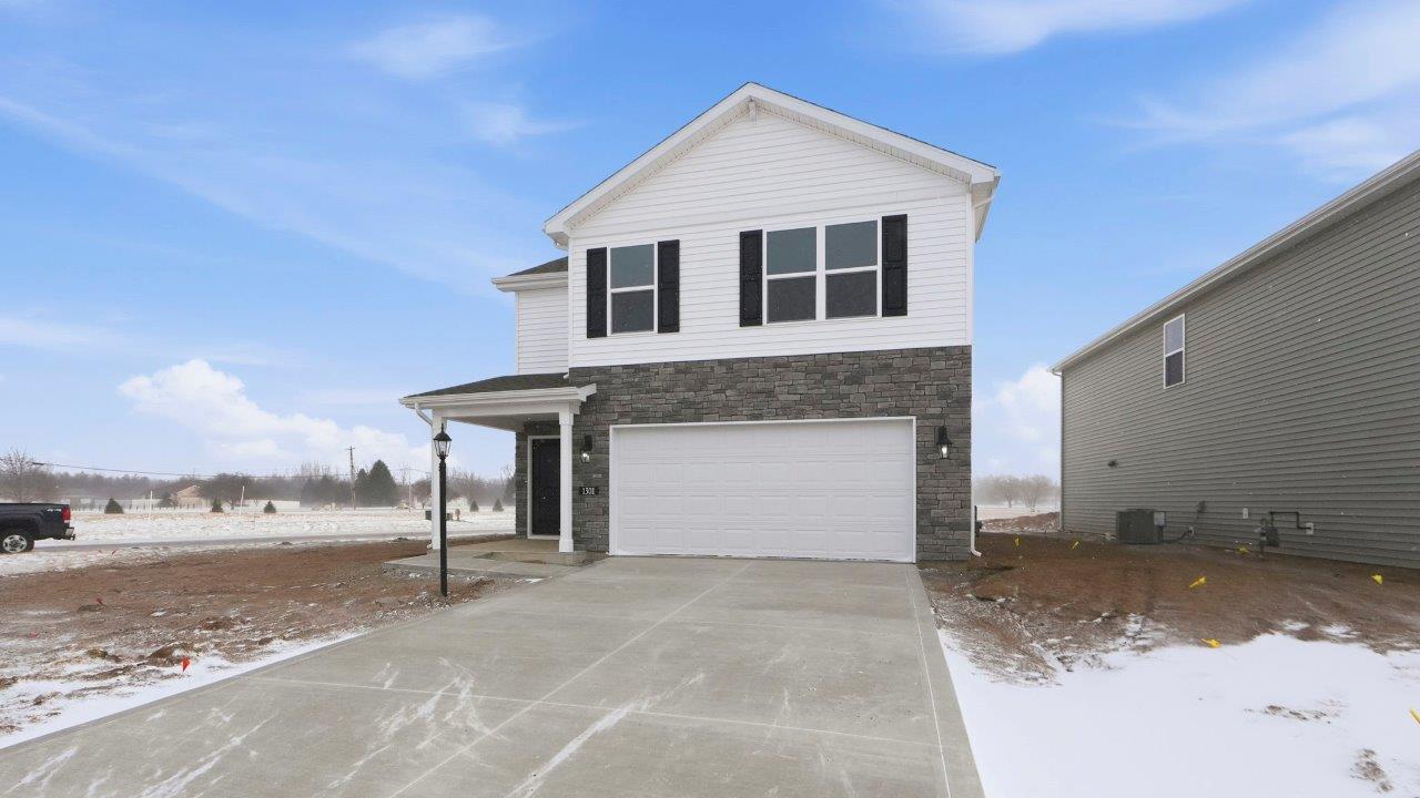 Greenbrier Elder exterior with 2 car garage and covered patio