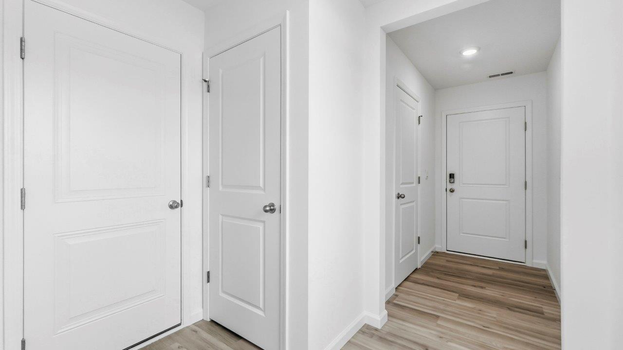 front door and hallway with lvp flooring