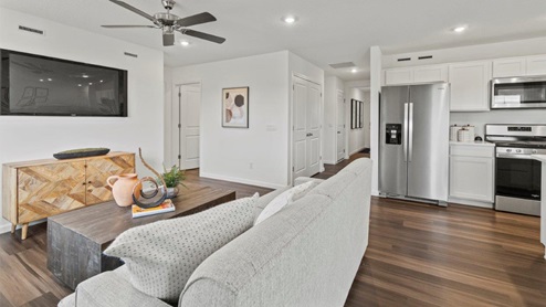 Riverwalk Aldridge Model Home - living room and kitchen open floor plan with LVP connecting all spaces