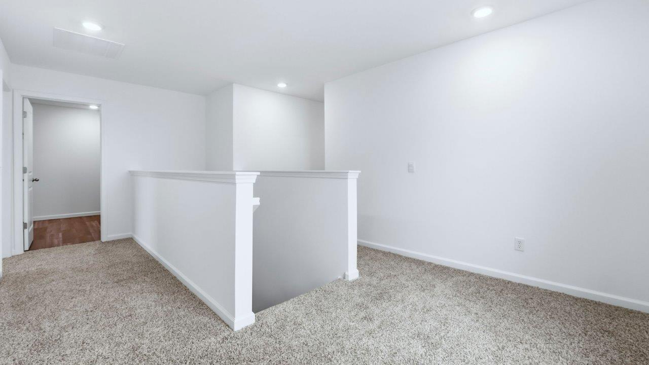 second floor top of staircase with carpet