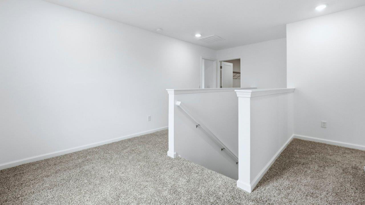 second floor top of staircase with carpet