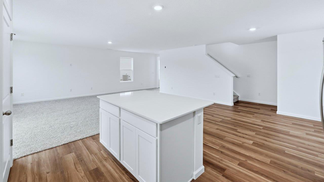 kitchen with staircase nearby