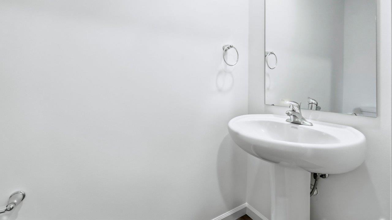 first floor half bathroom with pedestal sink