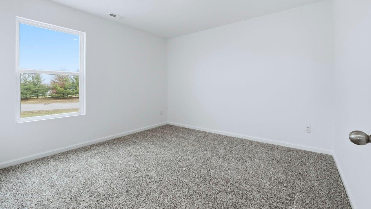 bedroom 3 with carpet and closet