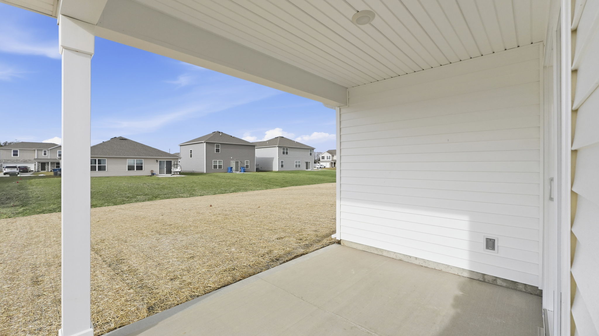 chatham rear exterior with covered patio and large backayrd