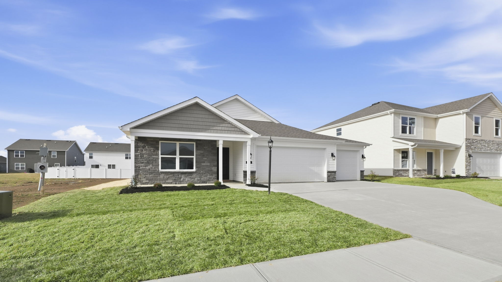 riverwalk chatham exterior with covered front porch and 3 car garage