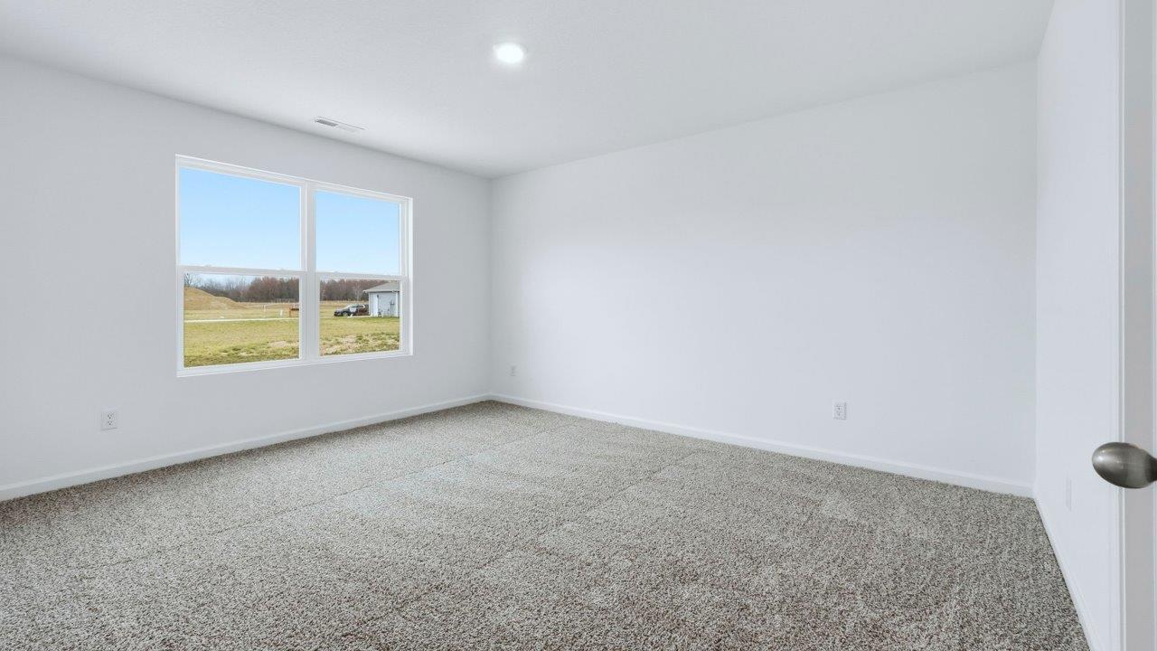 primary bedroom with ensuite bath and walk in closet