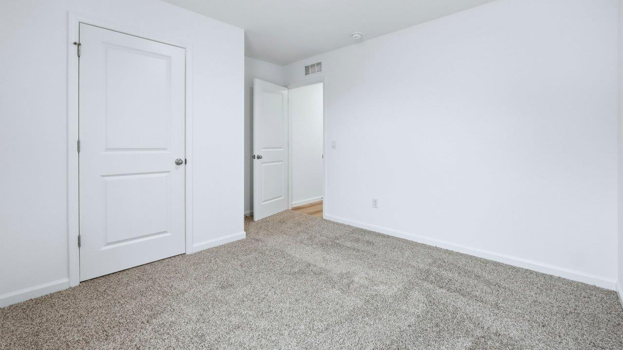 bedroom 2 with closet and carpet