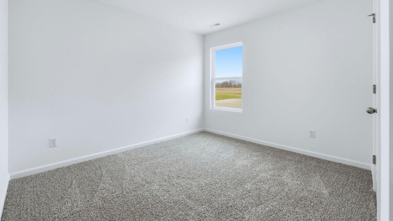 bedroom 2 with closet and carpet