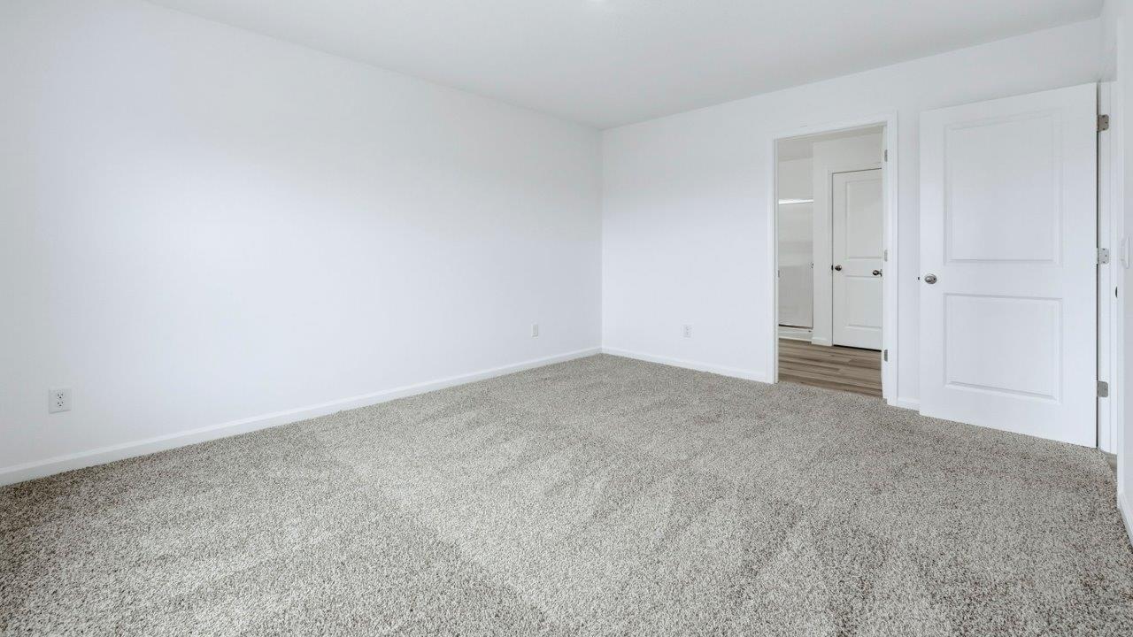 primary bedroom with ensuite bath and closet