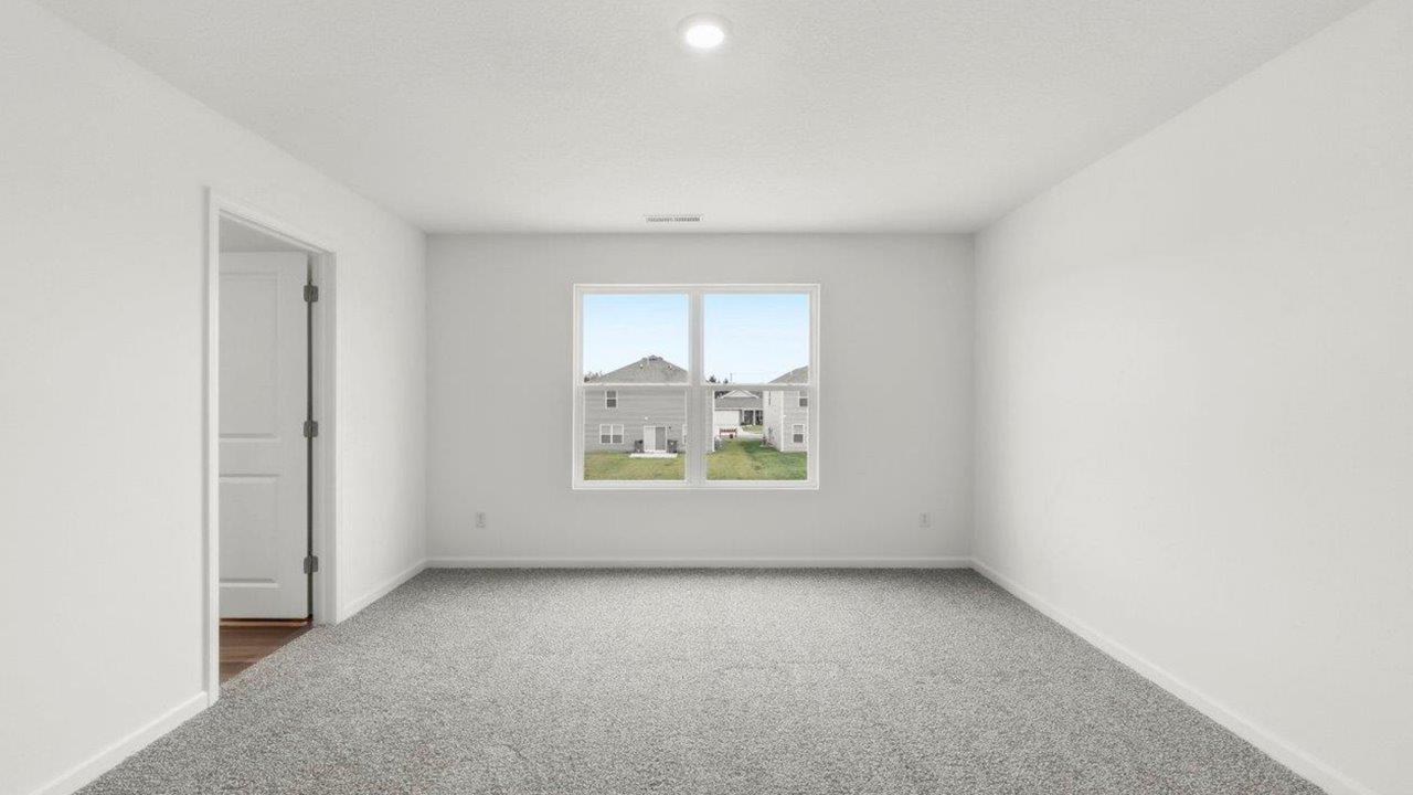 primary bedroom with ensuite bath and closet