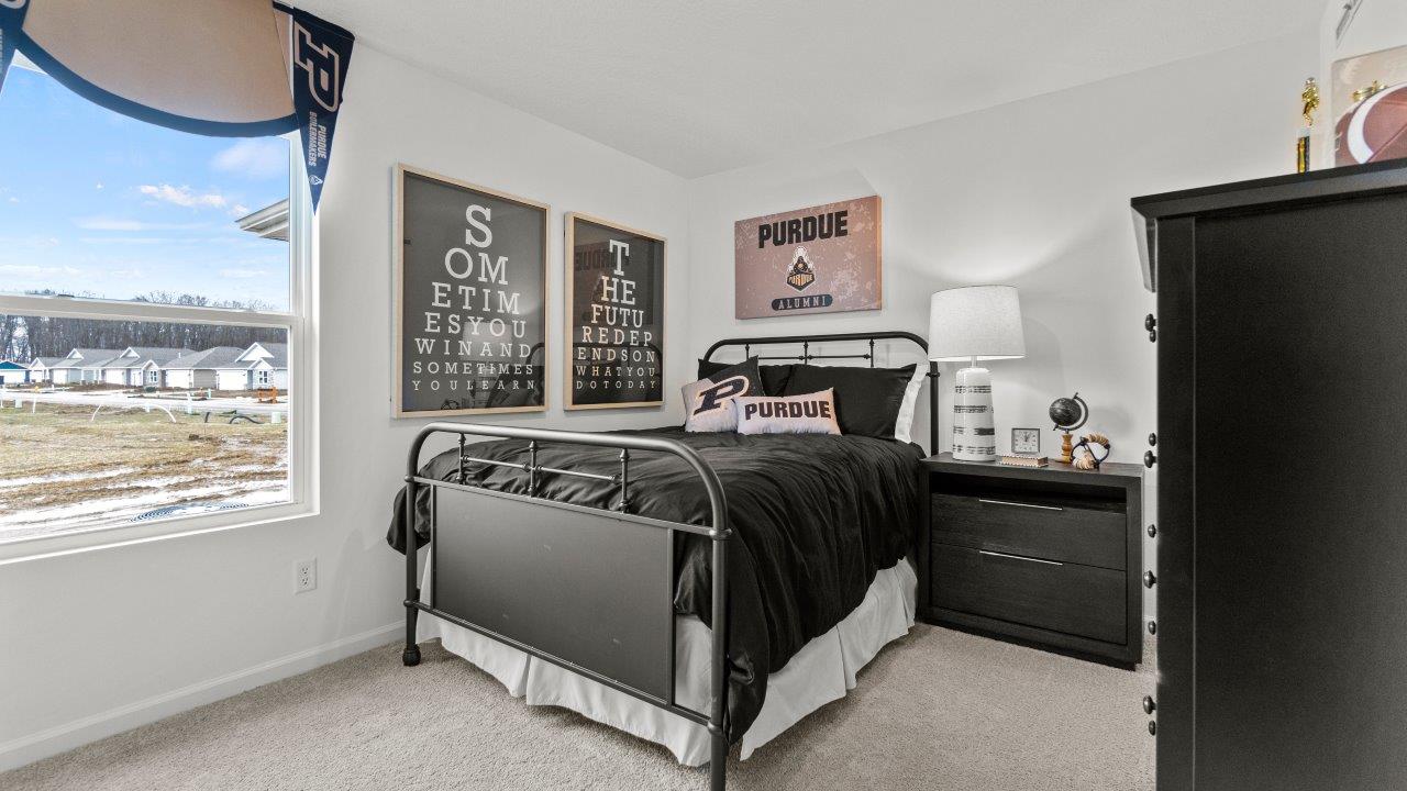 riverwalk aldridge model bedroom 2 with single window, closet, white walls, and elk beige carpet