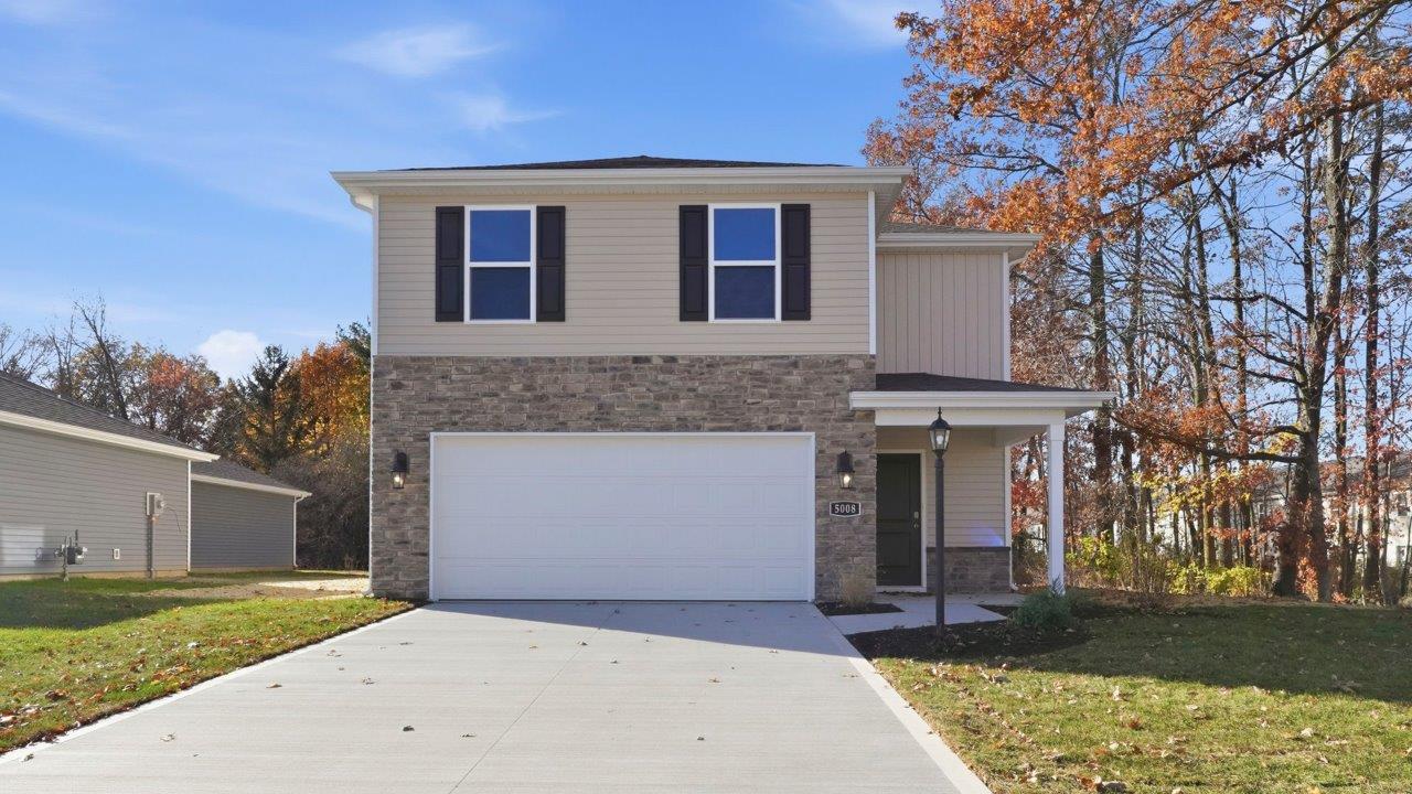 Kennebec spec home exterior 2 story with tree lines homesite and front porch