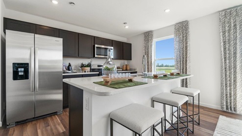 Kennebec Bellamy Model Home Kitchen with large island with room for seating and LVP flooring.