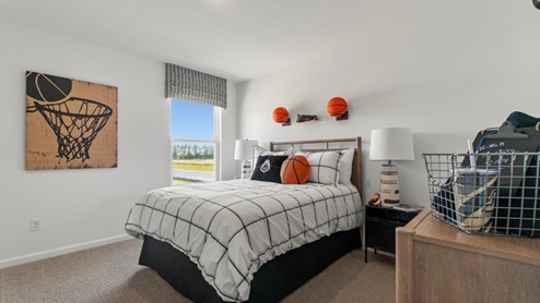 Kennebec Bellamy Model Home large Bedroom 3 with single window and carpet flooring.
