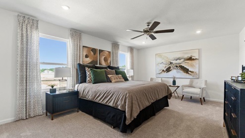 Kennebec Bellamy Model Home Large main bedroom with Bird Bath Carpe and 52" ceiling fan.