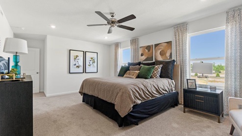 Kennebec Bellamy Model Home Main bedroom with large windows for natural light.