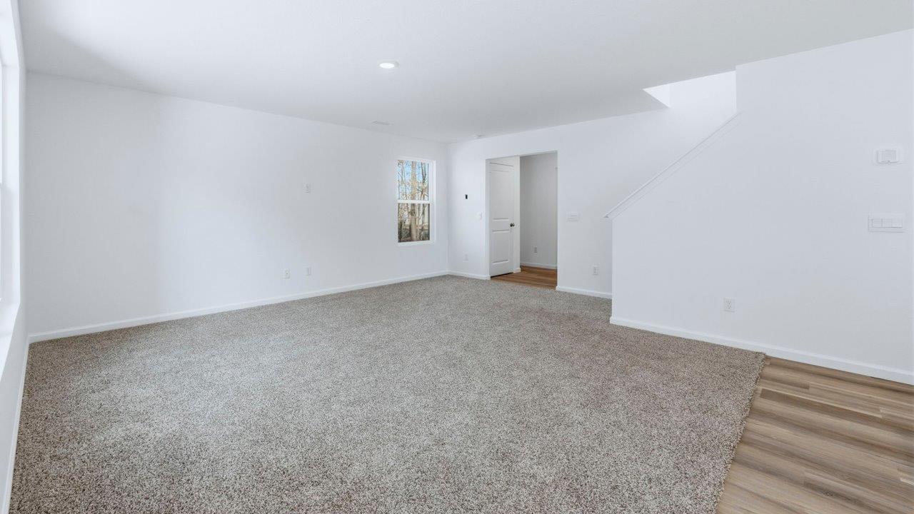 living room with carpet flooring in open layout