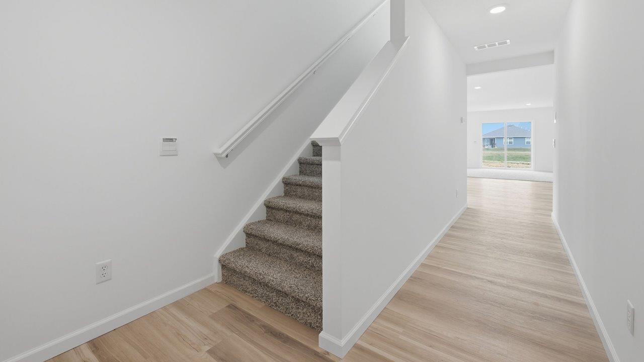 kennebec elm foyer with mohawk avery lvp flooring and white walls