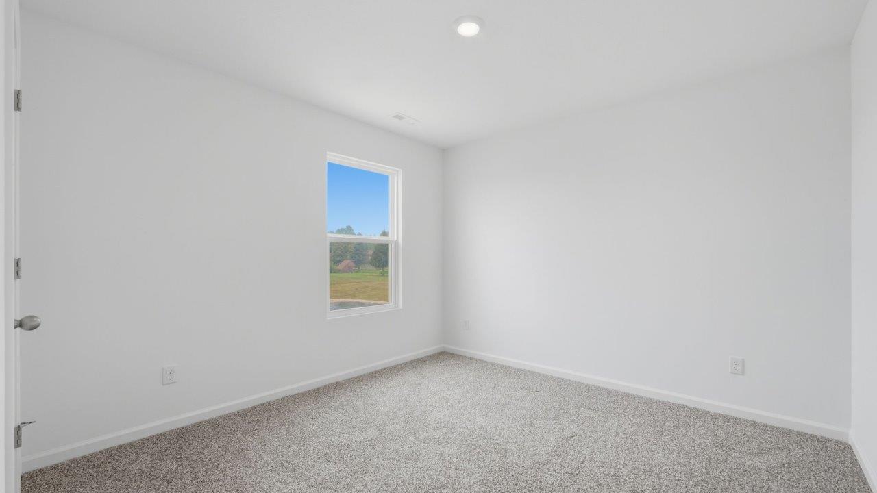 kennebec elm first floor bedroom 5 with carpet flooring, ensuite closet, and nearby full bathroom