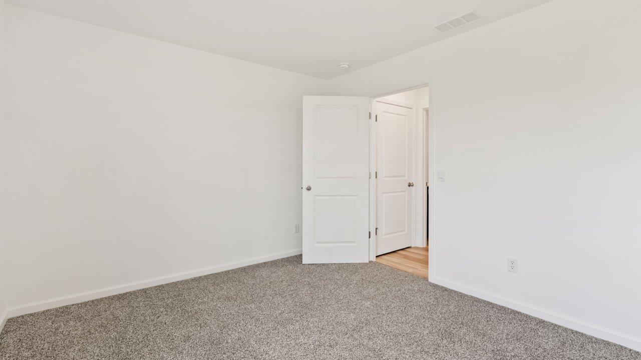 Kennebec Elm C3 - bedroom 2 on first floor with carpet flooring, ensuite closet, single window, and white walls