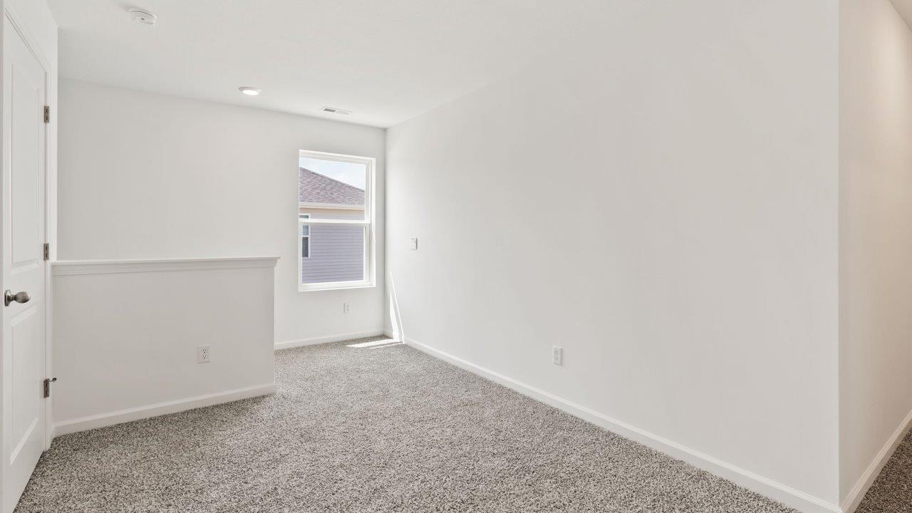 Kennebec Elm C3 - second floor loft and staircase landing with carpet flooring