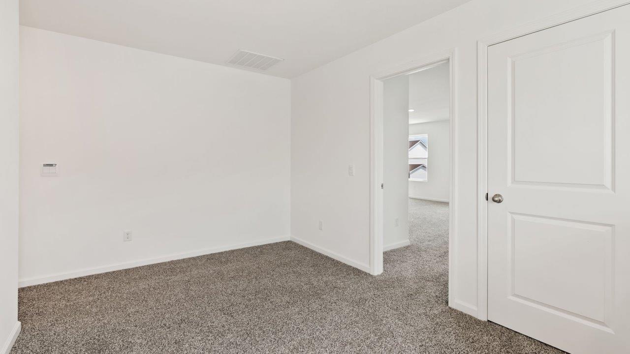 Kennebec Elm C3 - second floor loft and staircase landing with carpet flooring