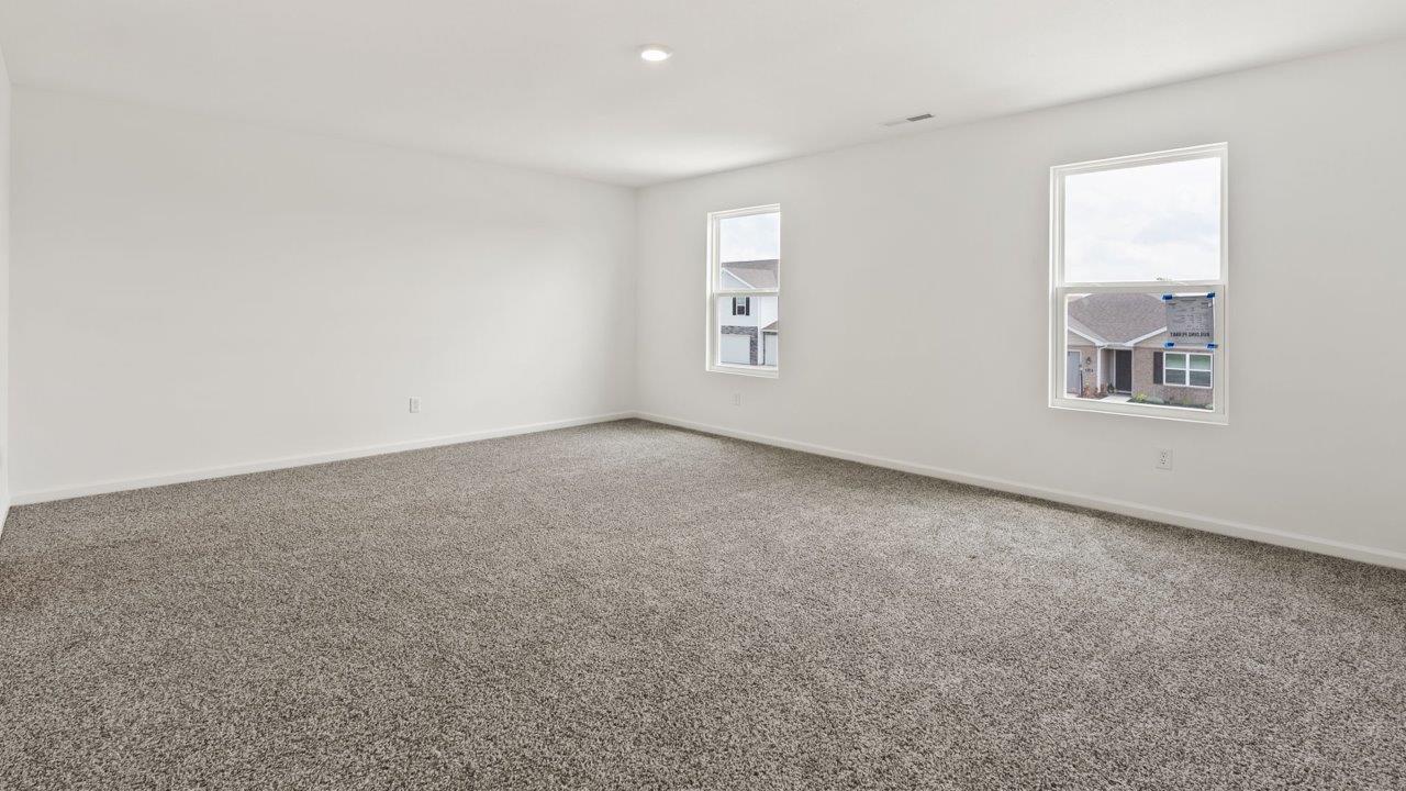 Kennebec Elm C3 - primary bedroom with ensuite bathroom and walk in closet with elk beige carpet flooring and 2 windows