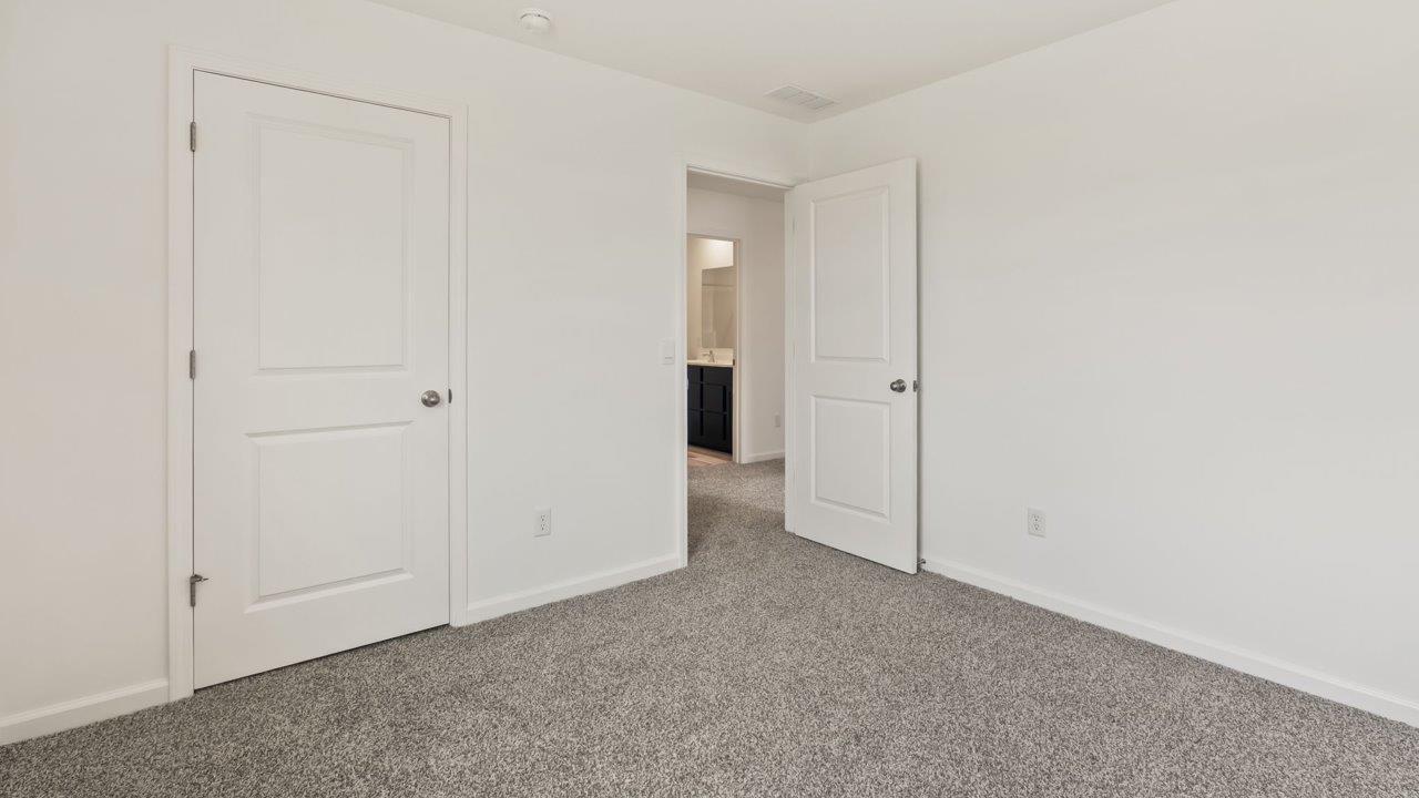 Kennebec Elm C3 - bedroom 4 with ensuite closet, single window, beige carpet, and white walls