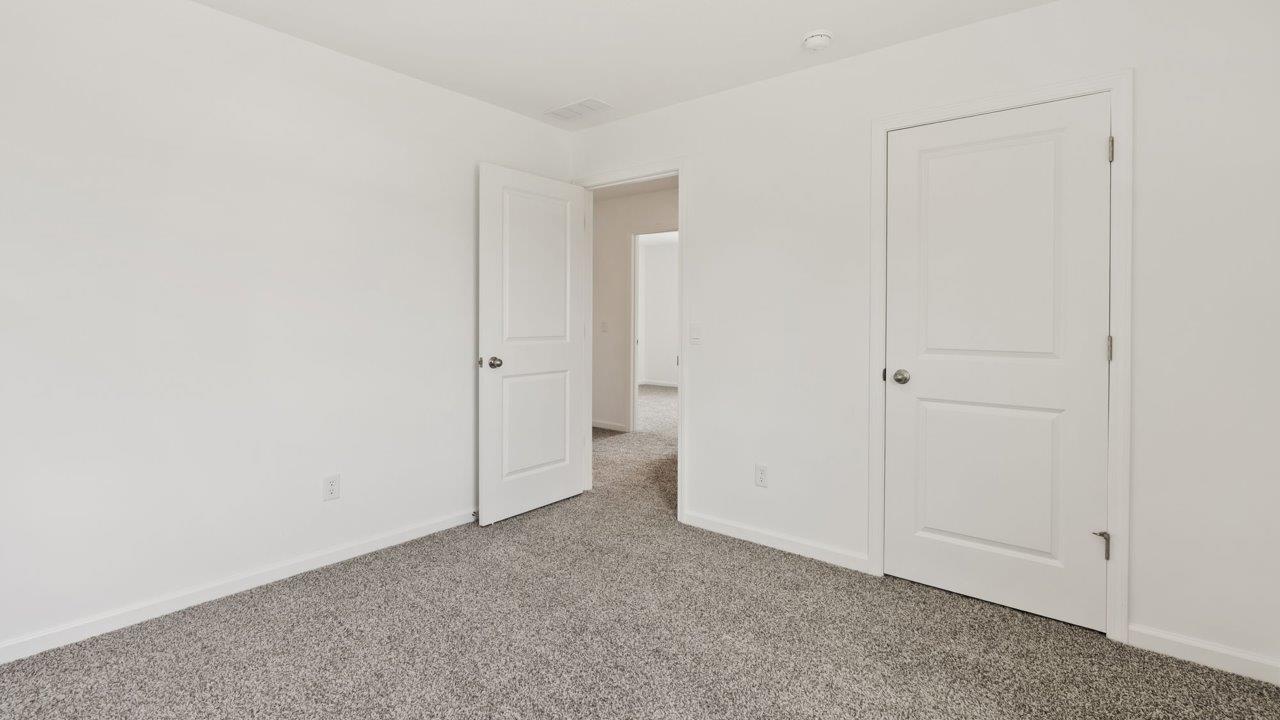 Kennebec Elm C3 - bedroom 5 with beige carpet, single window, white walls, and ensuite closet