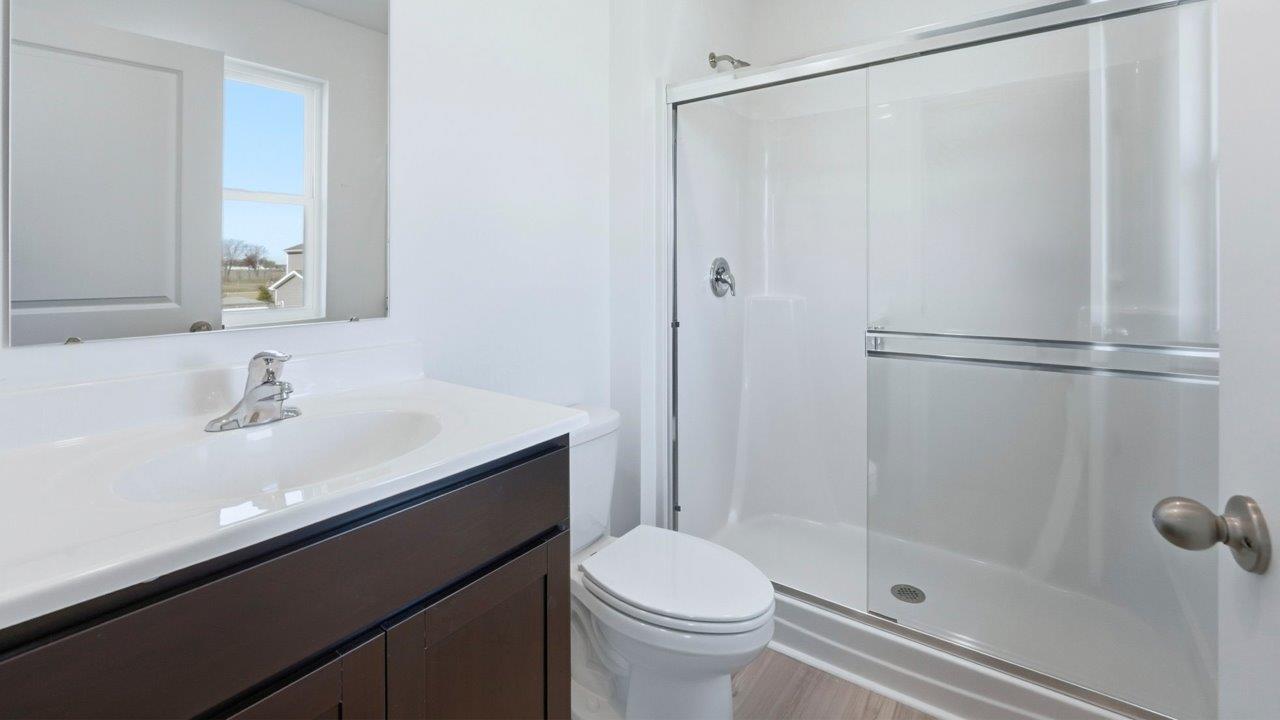 primary ensuite bathroom with walk in shower