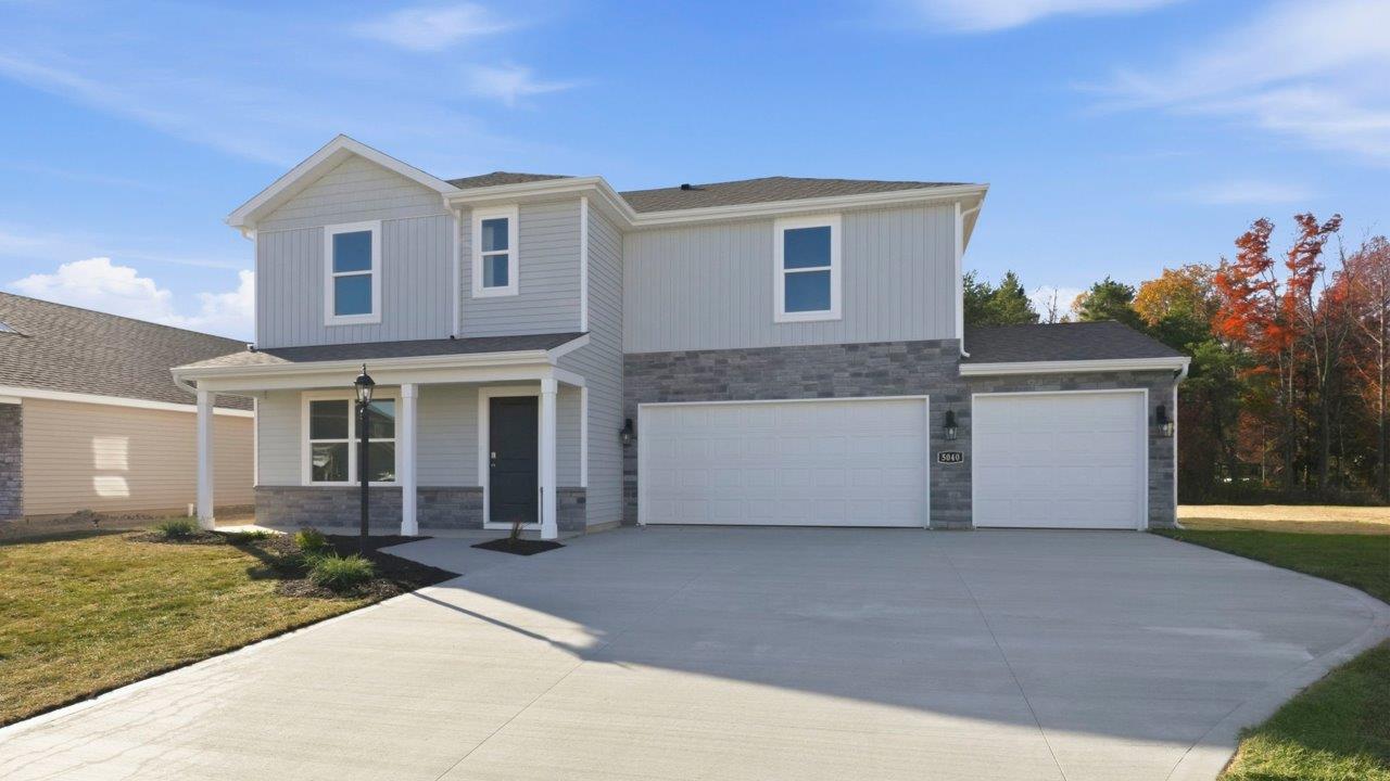 Kennebec Fairton with 3 car garage, sodded yard, and landscaping