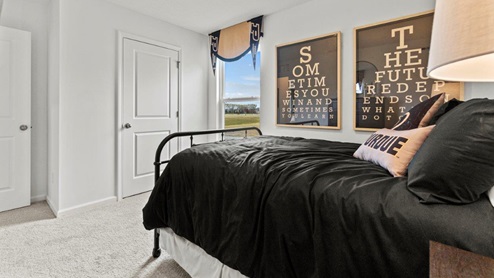 Riverwalk Villas Aldridge Model Home - Bedroom 2 with 1 window and conlon bird bath carpet.