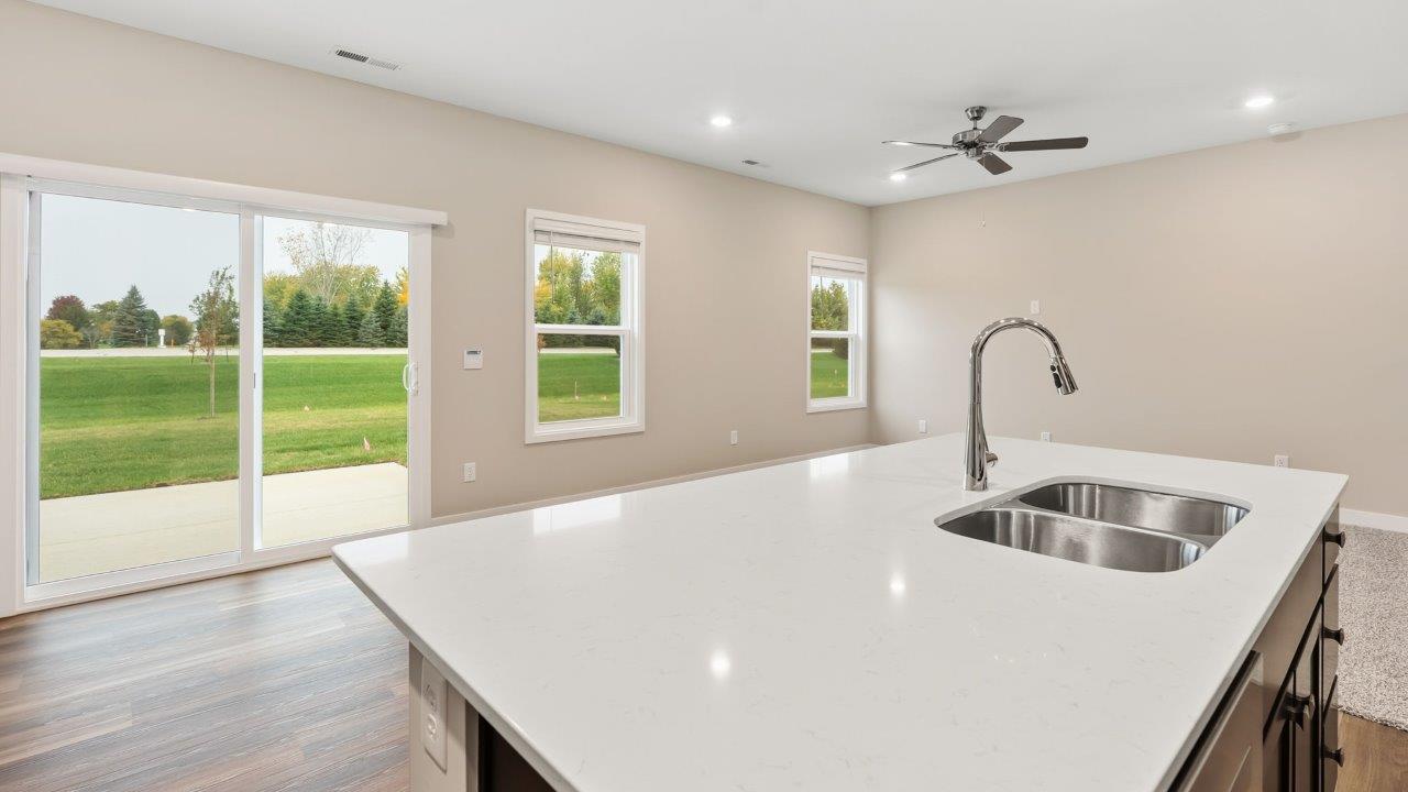 riverwalk villas harmony b3 kitchen island overlooking casual dining room and living room with breakfast bar seating