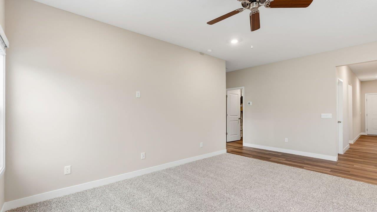 riverwalk villas harmony b3 open laayout living room with elk beige carpet flooring, ceiling fan, popular grey walls