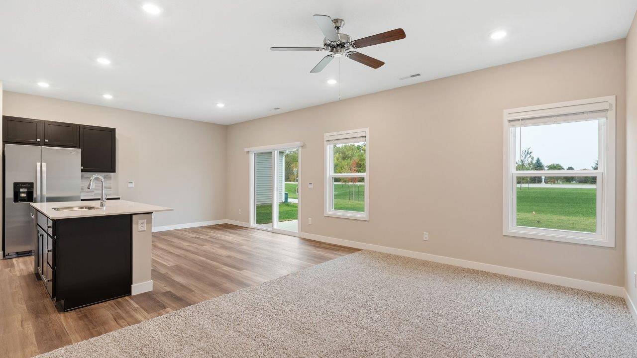 riverwalk villas harmony b3 open laayout living room with elk beige carpet flooring, ceiling fan, popular grey walls
