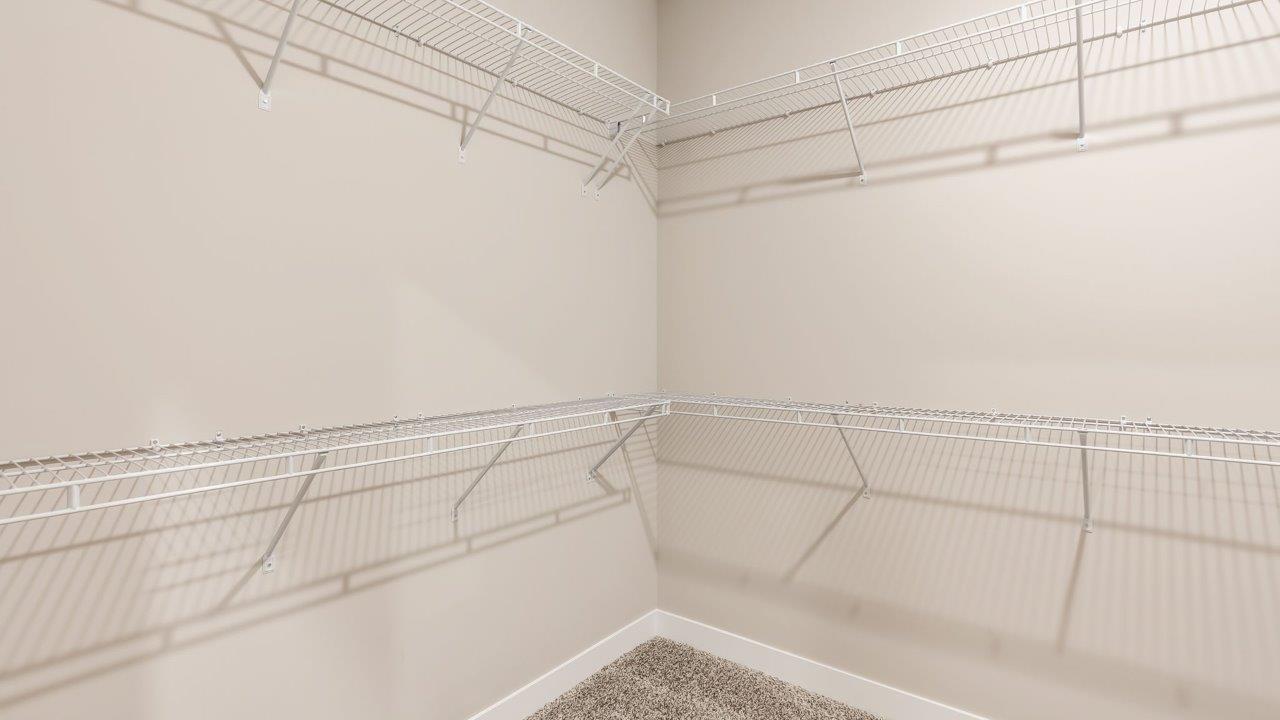riverwalk villas harmony b3 primary bedroom ensuite walk in closet with built in shelving