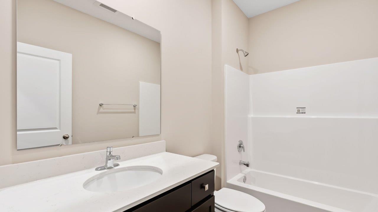 riverwalk villas harmony b3 full bathroom with single sink vanity and tub shower