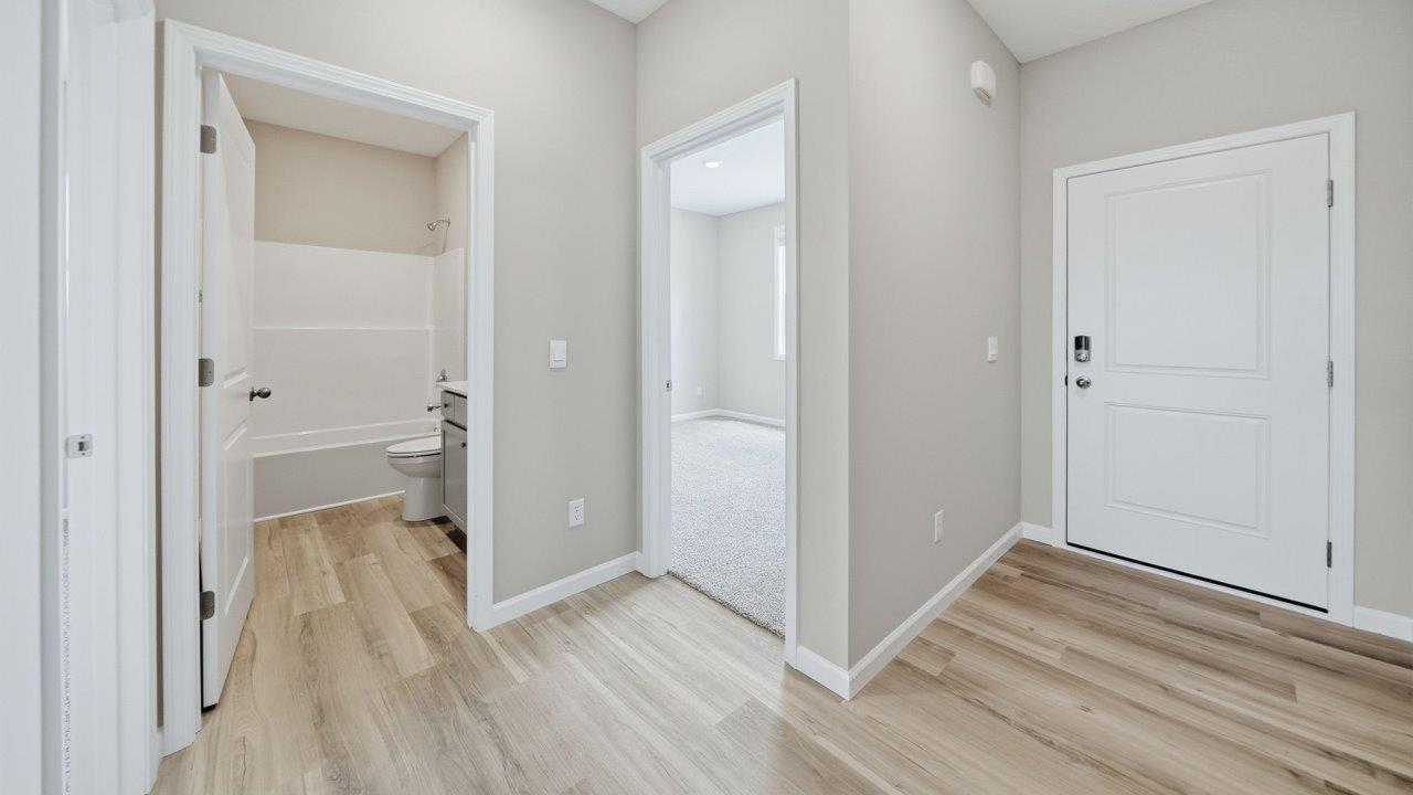 front door and foyer with lvp flooring