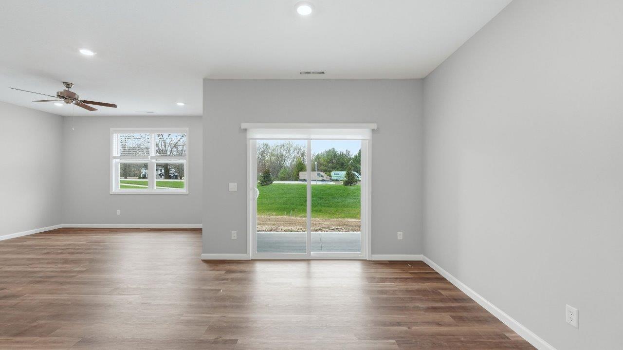casual dining room with sliding glass door to backyard covered patio and lvp flooring