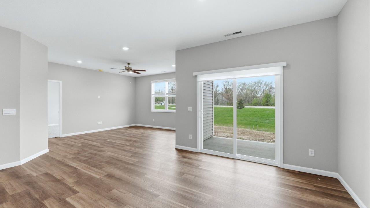 casual dining room with sliding glass door to backyard covered patio and lvp flooring
