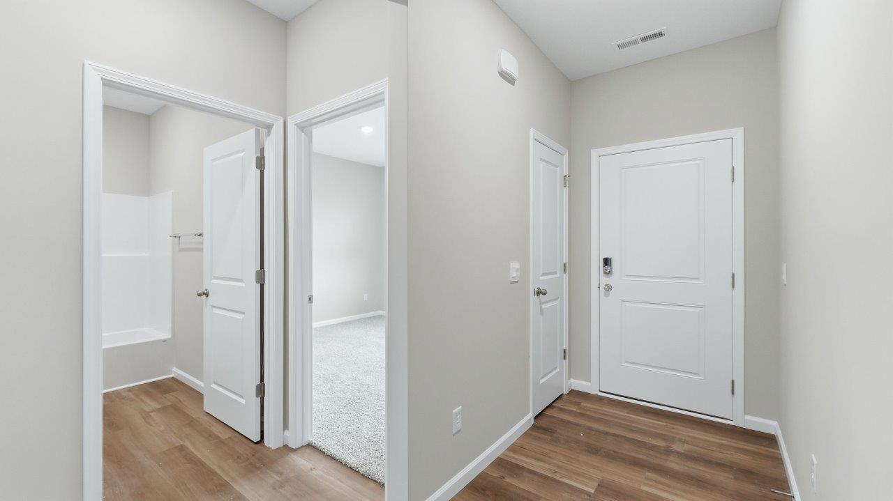 front door and foyer with lvp flooring