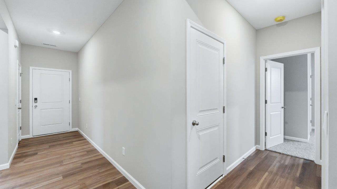 front door and foyer with lvp flooring