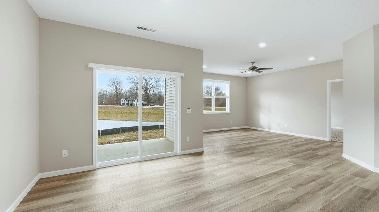 dining room with lvp and sliding door to backyard patio